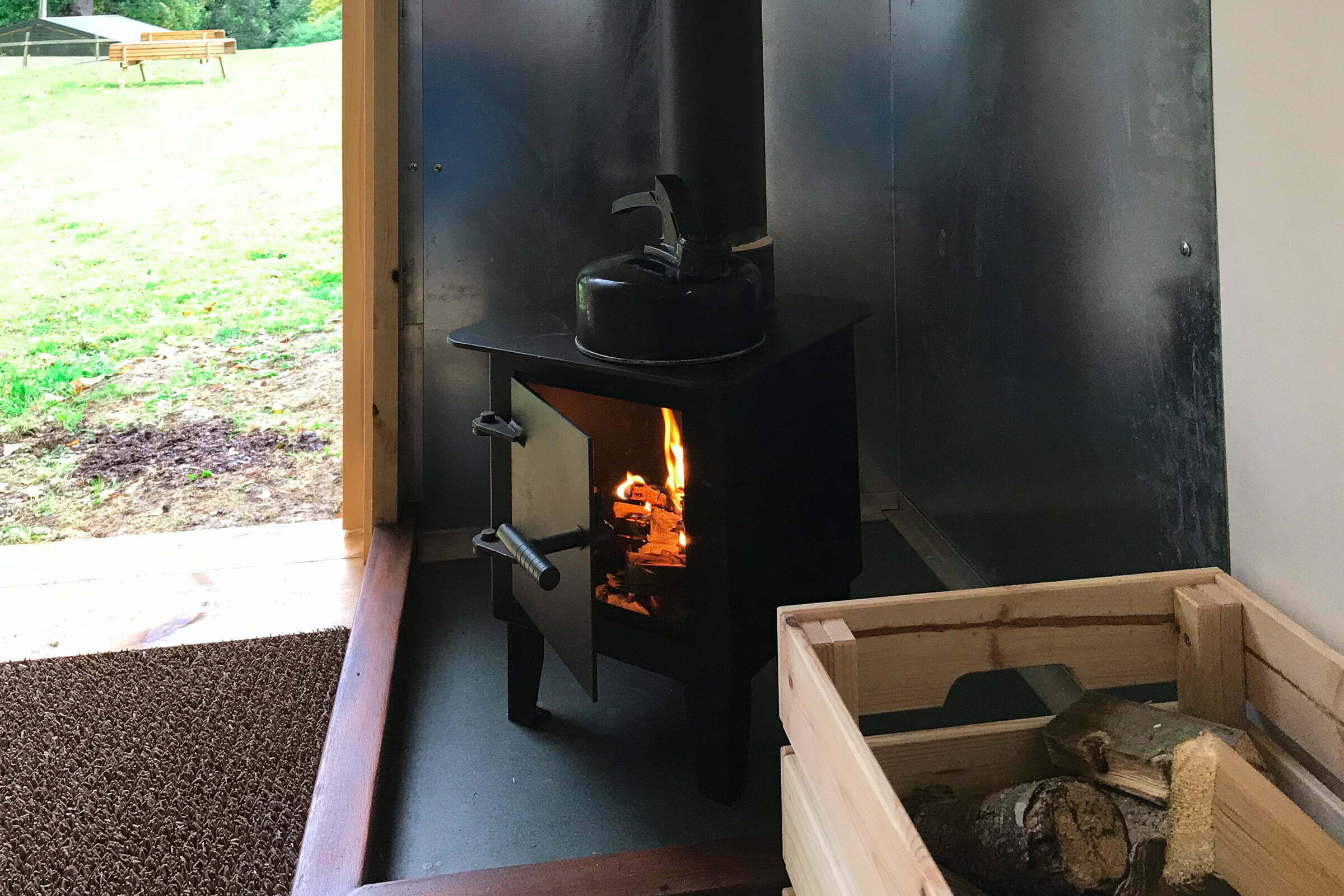 Painswick Glamping – Shepherd Hut wood burner and entrance
